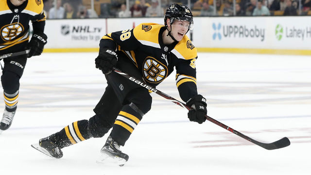 BOSTON, MA - SEPTEMBER 26: Boston Bruins defenseman Urho Vaakanainen (58) watches his shot during a preseason game between the Boston Bruins and the Detroit Red Wings on September 26, 2018, at TD Garden in Boston, Massachusetts. The Red Wings defeated the Bruins 3-2 (OT).