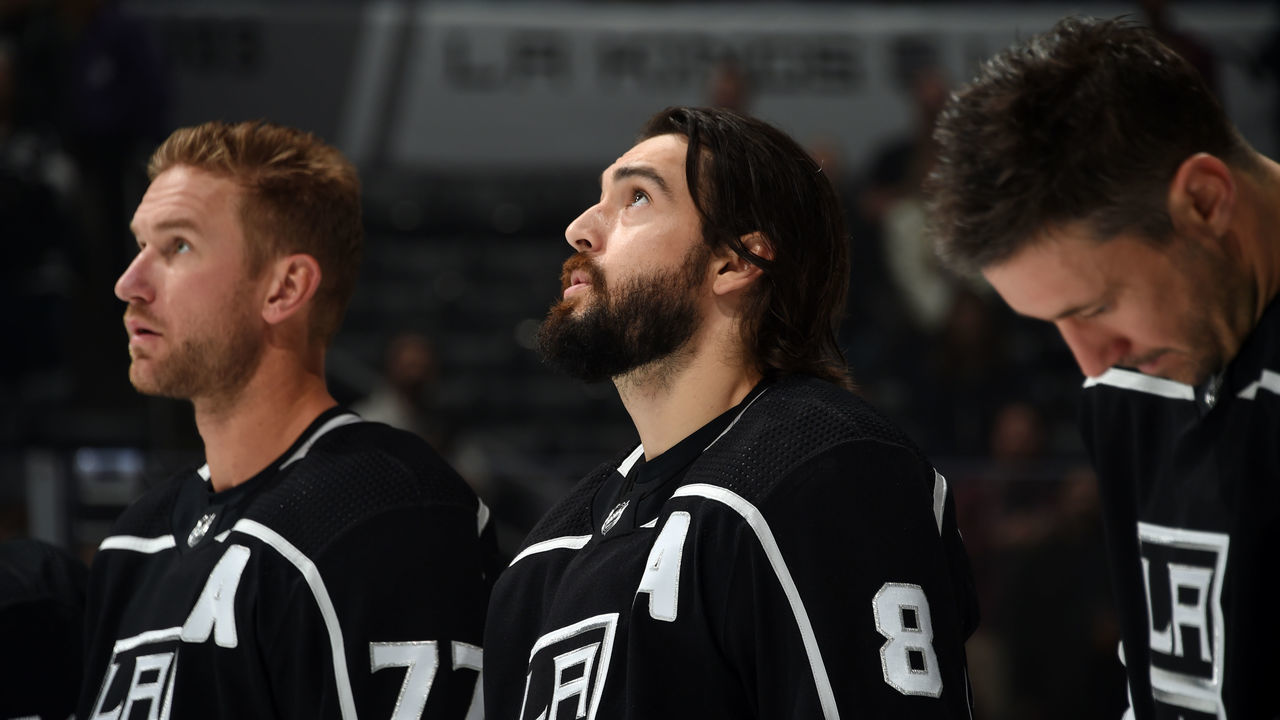 LOS ANGELES, CA - OCTOBER 18: Jeff Carter #77 and Drew Doughty #8 of the Los Angeles Kings listen to the national anthem before the game against the New York Islanders at STAPLES Center on October 18, 2018 in Los Angeles, California.
