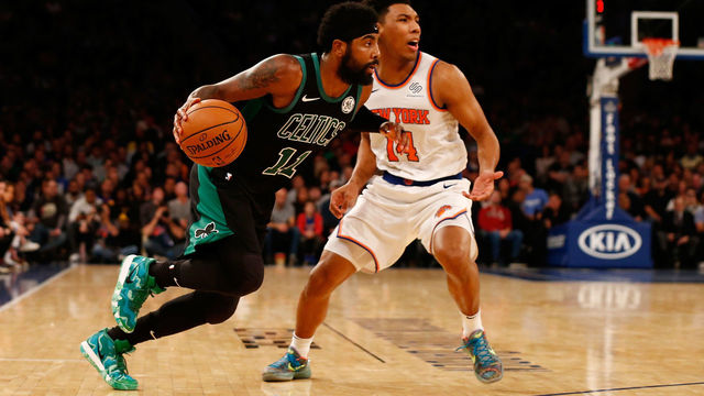 NEW YORK, NY - OCTOBER 20: Kyrie Irving #11 of the Boston Celtics dribbles the ball against Allonzo Trier #14 of the New York Knicks at Madison Square Garden on October 20, 2018 in New York City.