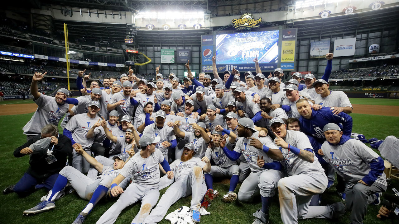 MILWAUKEE, WI - OCTOBER 20: The Los Angeles Dodgers celebrate after defeating the Milwaukee Brewers in Game Seven to win the National League Championship Series at Miller Park on October 20, 2018 in Milwaukee, Wisconsin.