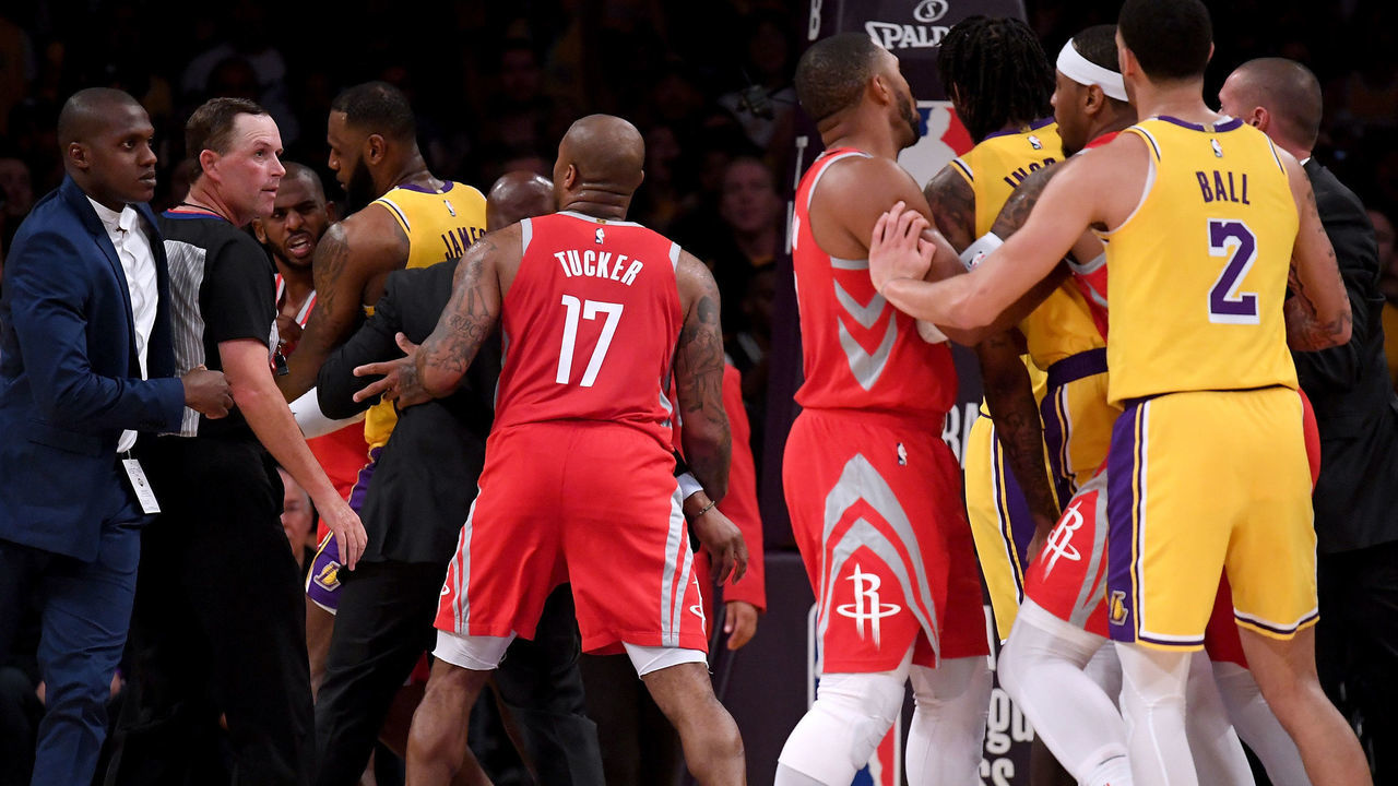 LOS ANGELES, CA - OCTOBER 20: Chris Paul #3 of the Houston Rockets is restrained by LeBron James #23 of the Los Angeles Lakers after a fight involving Rajon Rondo #9 and Brandon Ingram #14 of the Los Angeles Lakers during a 124-1115 Rockets win at Staples Center on October 20, 2018 in Los Angeles, California.