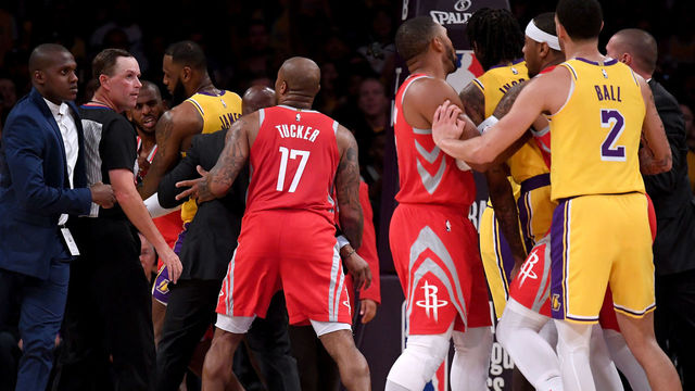 LOS ANGELES, CA - OCTOBER 20: Chris Paul #3 of the Houston Rockets is restrained by LeBron James #23 of the Los Angeles Lakers after a fight involving Rajon Rondo #9 and Brandon Ingram #14 of the Los Angeles Lakers during a 124-1115 Rockets win at Staples Center on October 20, 2018 in Los Angeles, California.