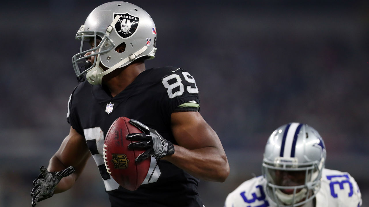 ARLINGTON, TX - AUGUST 26: Amari Cooper #89 of the Oakland Raiders scores a second quarter touchdown against the Dallas Cowboys in a preseason game at AT&T Stadium on August 26, 2017 in Arlington, Texas.