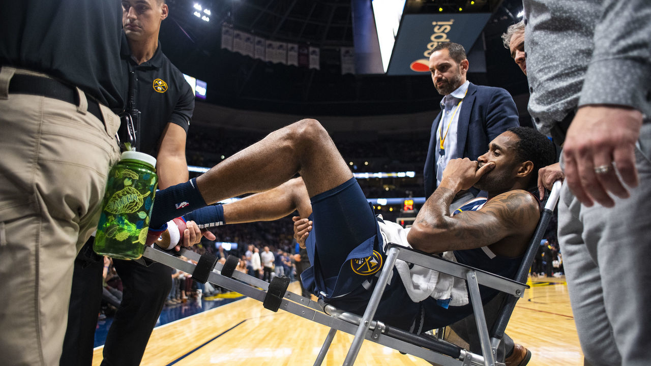 DENVER, CO - OCTOBER 20: Will Barton #5 of the Denver Nuggets is carted off following a hip injury during the second half against the Phoenix Suns at Pepsi Center on October 20, 2018 in Denver, Colorado.