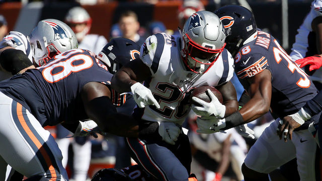 CHICAGO, IL - OCTOBER 21: Sony Michel #26 of the New England Patriots carries the football in the first quarter against the Chicago Bears at Soldier Field on October 21, 2018 in Chicago, Illinois.