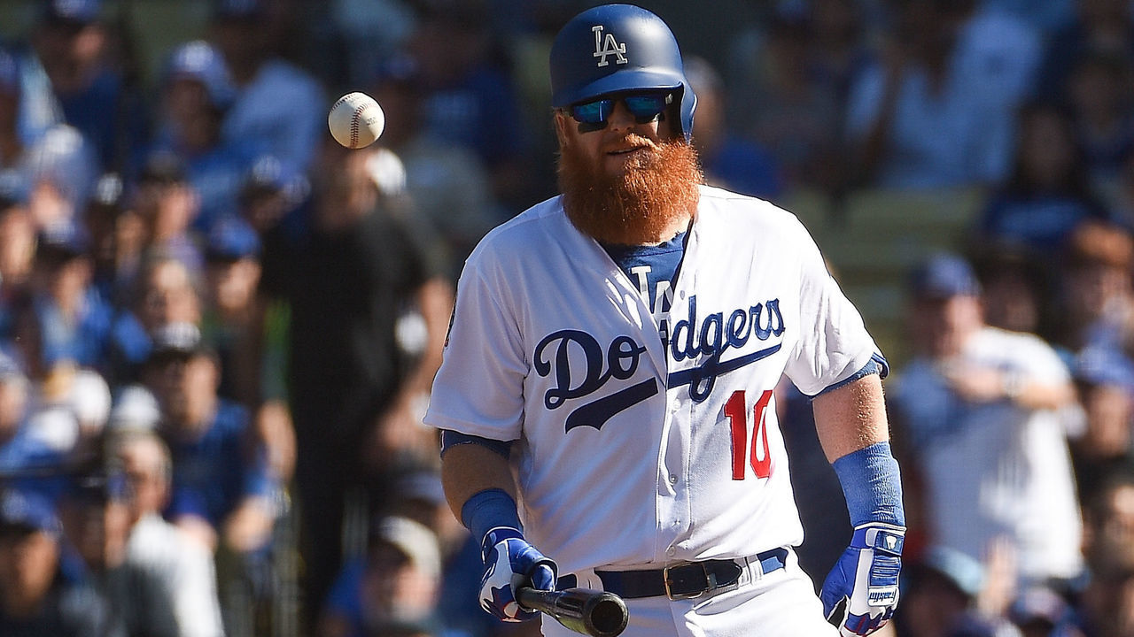 LOS ANGELES, CA - OCTOBER 17: Justin Turner #10 of the Los Angeles Dodgers is hit by a pitch against the Milwaukee Brewers during the first inning in Game Five of the National League Championship Series at Dodger Stadium on October 17, 2018 in Los Angeles, California.