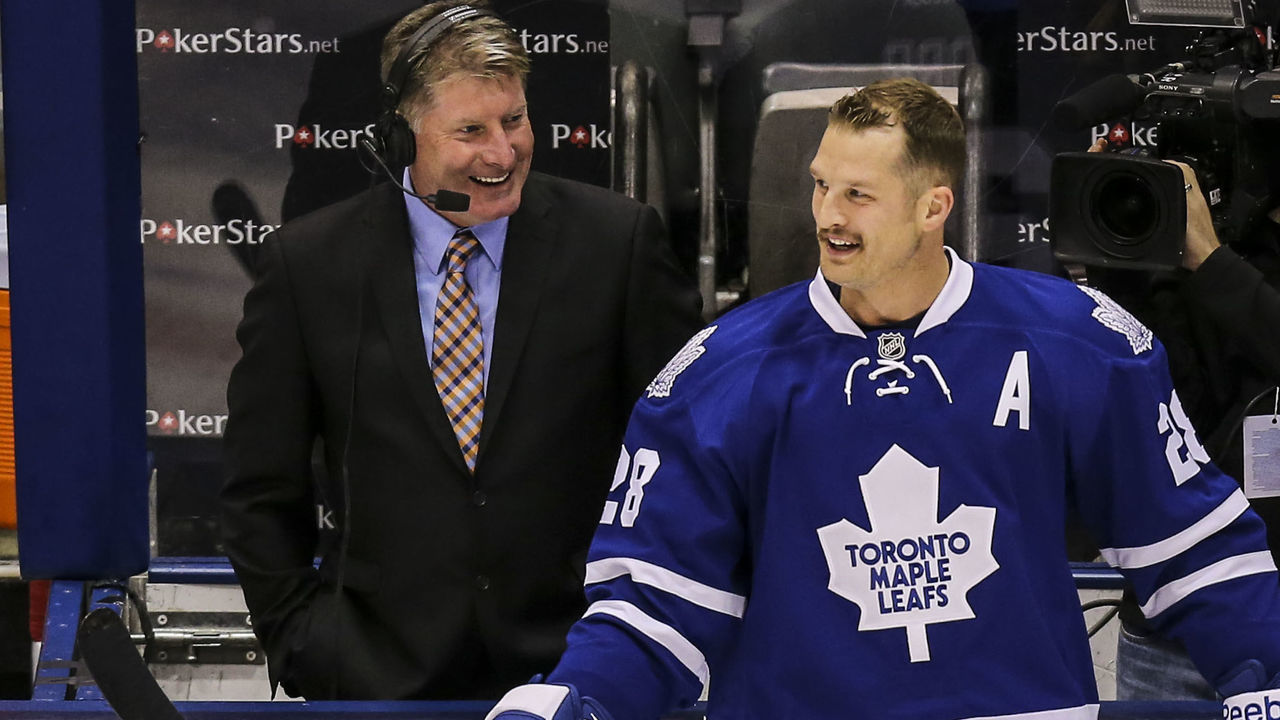 TORONTO, ON- SEPTEMBER 28 - Toronto Maple Leafs right wing Colton Orr (28) jokes with broadcaster and former goalie Glenn Healy during the warm-up as the Toronto Maple Leafs host the Detroit Red Wings at the Air Canada Centre in Toronto, September 28, 2013. (David Cooper/Toronto Star via Getty Images)