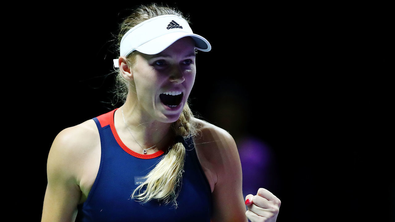 SINGAPORE - OCTOBER 23: Caroline Wozniacki of Denmark reacts to match point in her singles match with Petra Kvitova of the Czech Republic prior to their singles match during day 3 of the BNP Paribas WTA Finals Singapore presented by SC Global at Singapore Sports Hub on October 23, 2018 in Singapore.