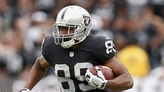 OAKLAND, CA - SEPTEMBER 30: Amari Cooper #89 of the Oakland Raiders tries to outrun T.J. Carrie #38 of the Cleveland Browns at Oakland-Alameda County Coliseum on September 30, 2018 in Oakland, California.