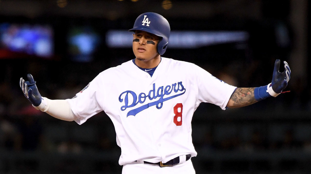 LOS ANGELES, CA - OCTOBER 15: Manny Machado #8 of the Los Angeles Dodgers reacts after hitting a double during the ninth inning against the Milwaukee Brewers in Game Three of the National League Championship Series at Dodger Stadium on October 15, 2018 in Los Angeles, California.