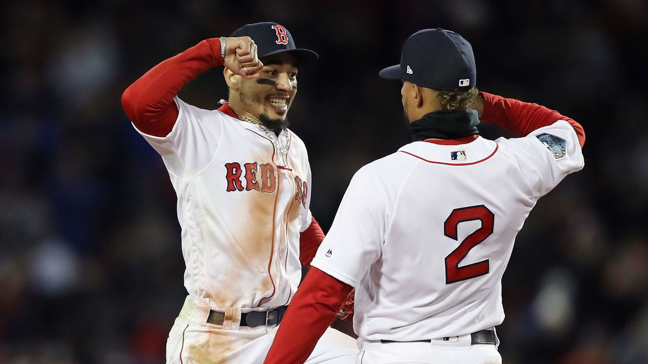 BOSTON, MA - OCTOBER 24: Mookie Betts #50 and Xander Bogaerts #2 of the Boston Red Sox celebrate their teams 4-2 win over the Los Angeles Dodgers in Game Two of the 2018 World Series at Fenway Park on October 24, 2018 in Boston, Massachusetts.