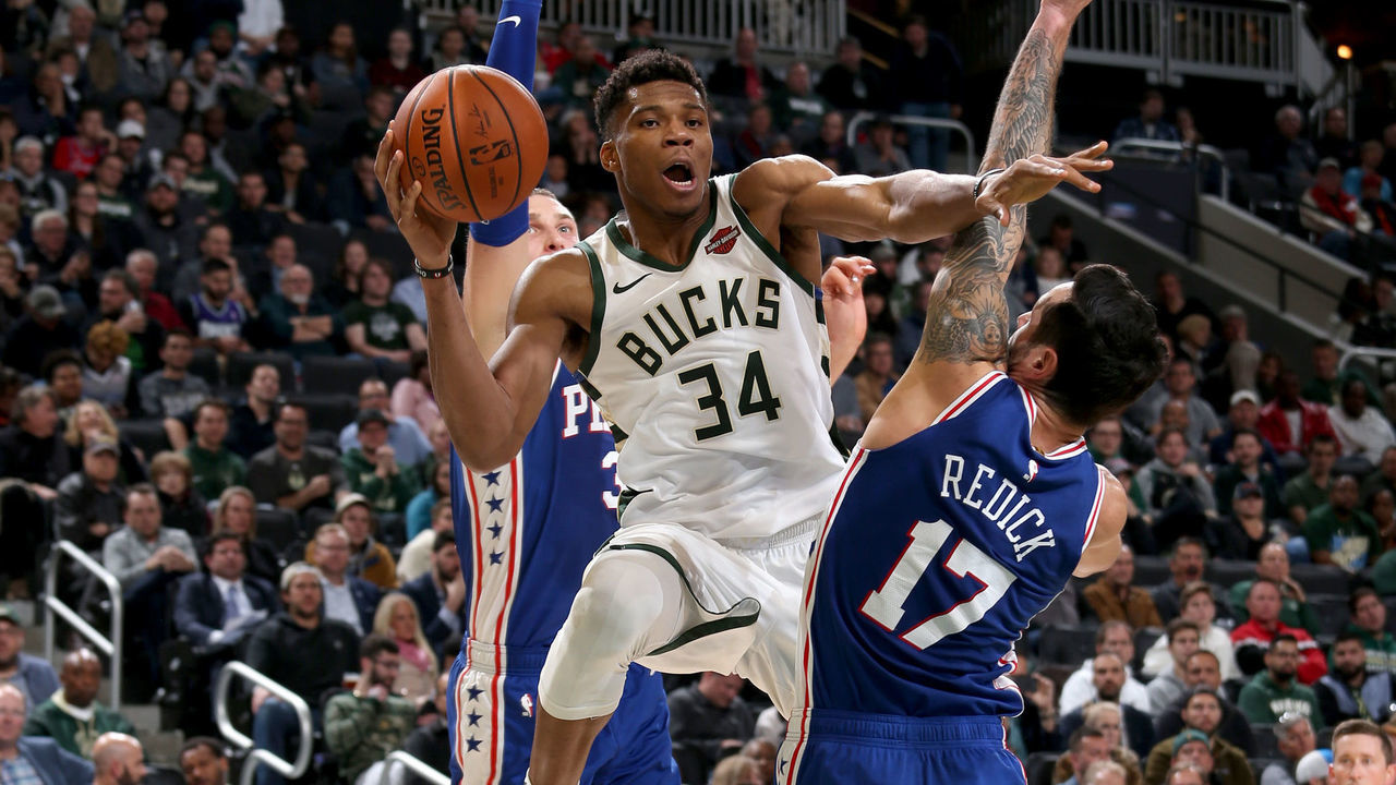 MILWAUKEE, WI - OCTOBER 24: Giannis Antetokounmpo #34 of the Milwaukee Bucks passes the ball against the Philadelphia 76ers on October 24, 2018 at Fiserv Forum in Milwaukee, Wisconsin. NOTE TO USER: User expressly acknowledges and agrees that, by downloading and/or using this photograph, user is consenting to the terms and conditions of the Getty Images License Agreement. Mandatory Copyright Notice: Copyright 2018 NBAE