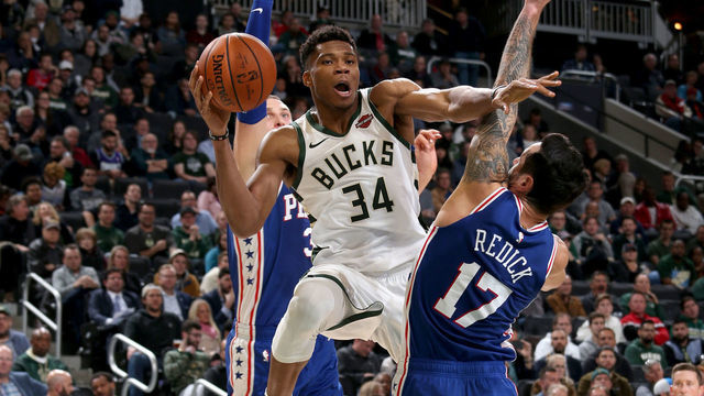 MILWAUKEE, WI - OCTOBER 24: Giannis Antetokounmpo #34 of the Milwaukee Bucks passes the ball against the Philadelphia 76ers on October 24, 2018 at Fiserv Forum in Milwaukee, Wisconsin. NOTE TO USER: User expressly acknowledges and agrees that, by downloading and/or using this photograph, user is consenting to the terms and conditions of the Getty Images License Agreement. Mandatory Copyright Notice: Copyright 2018 NBAE