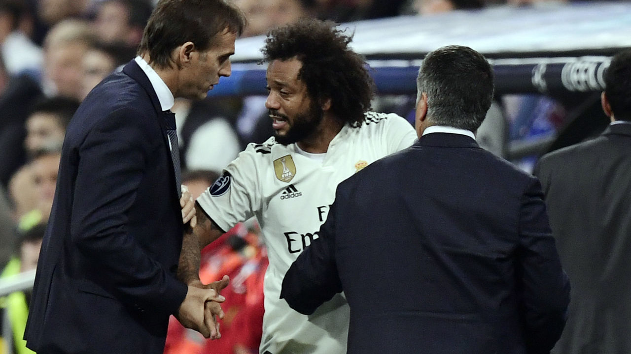 Real Madrid's Brazilian defender Marcelo talks with Real Madrid's Spanish coach Julen Lopetegui (L) after resulting injured during the UEFA Champions League group G football match between Real Madrid CF and FC Viktoria Plzen at the Santiago Bernabeu stadium in Madrid on October 23, 2018.