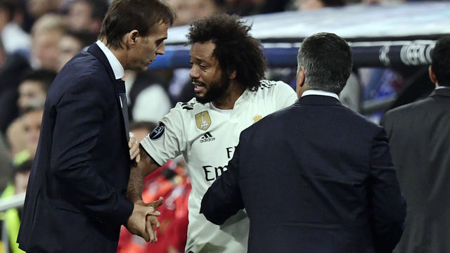 Real Madrid's Brazilian defender Marcelo talks with Real Madrid's Spanish coach Julen Lopetegui (L) after resulting injured during the UEFA Champions League group G football match between Real Madrid CF and FC Viktoria Plzen at the Santiago Bernabeu stadium in Madrid on October 23, 2018.