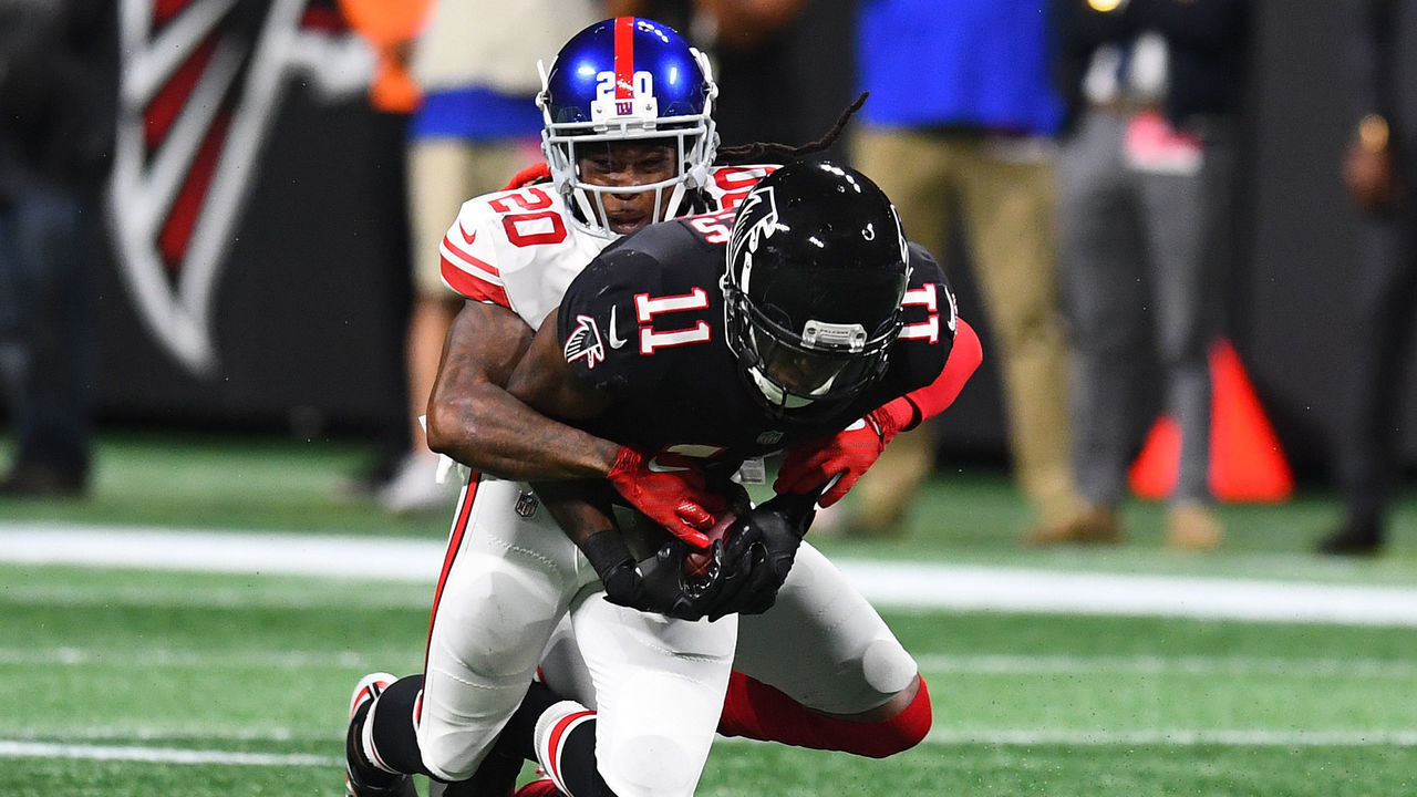 ATLANTA, GA - OCTOBER 22: Julio Jones #11 of the Atlanta Falcons is tackled by Janoris Jenkins #20 of the New York Giants in the third quarter at Mercedes-Benz Stadium on October 22, 2018 in Atlanta, Georgia.