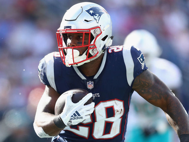 FOXBOROUGH, MA - SEPTEMBER 30: James White #28 of the New England Patriots runs with the ball during the second half against the Miami Dolphins at Gillette Stadium on September 30, 2018 in Foxborough, Massachusetts.