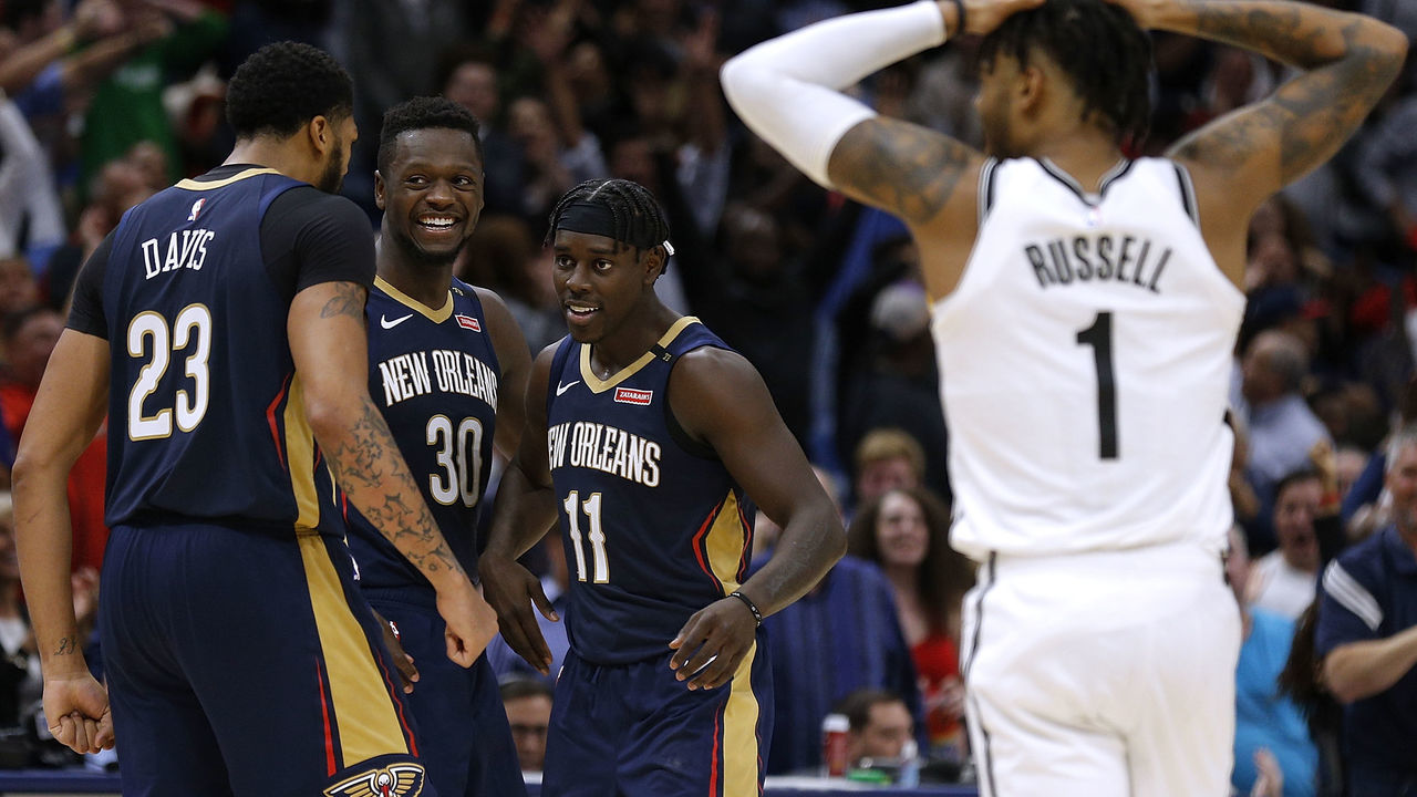 NEW ORLEANS, LA - OCTOBER 26: Jrue Holiday #11 of the New Orleans Pelicans celebrates with Anthony Davis #23 and Julius Randle #30, after hitting a game-winning score during the second half against the Brooklyn Nets at the Smoothie King Center on October 26, 2018 in New Orleans, Louisiana.