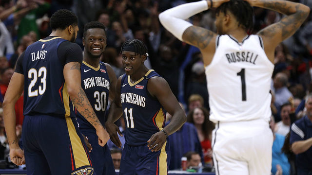 NEW ORLEANS, LA - OCTOBER 26: Jrue Holiday #11 of the New Orleans Pelicans celebrates with Anthony Davis #23 and Julius Randle #30, after hitting a game-winning score during the second half against the Brooklyn Nets at the Smoothie King Center on October 26, 2018 in New Orleans, Louisiana.