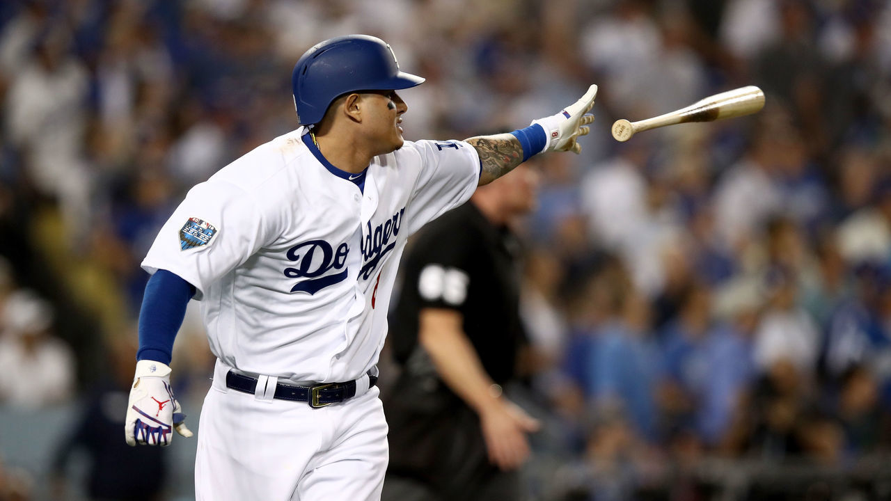 LOS ANGELES, CA - OCTOBER 26: Manny Machado #8 of the Los Angeles Dodgers hits a sixth inning single off the wall against the Boston Red Sox in Game Three of the 2018 World Series at Dodger Stadium on October 26, 2018 in Los Angeles, California.