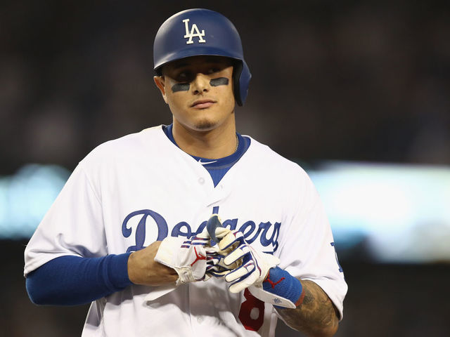 LOS ANGELES, CA - OCTOBER 26: Manny Machado #8 of the Los Angeles Dodgers reacts after flying out during the tenth inning against the Boston Red Sox in Game Three of the 2018 World Series at Dodger Stadium on October 26, 2018 in Los Angeles, California.