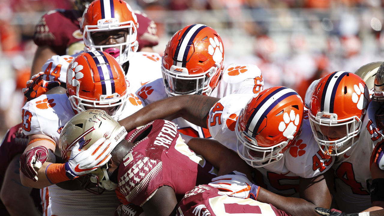 TALLAHASSEE, FL - OCTOBER 27: A group of Clemson Tigers defenders make a tackle for loss against Jacques Patrick #9 of the Florida State Seminoles in the third quarter of the game at Doak Campbell Stadium on October 27, 2018 in Tallahassee, Florida. Clemson won 59-10.