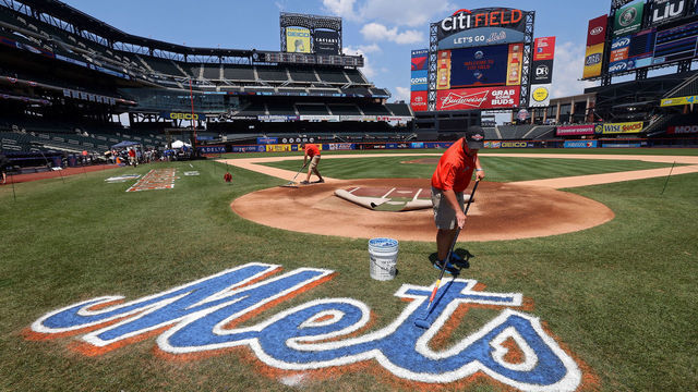 NEW YORK, NY - JULY 16: A grounds crew member paints the Mets logo on the field during the 84th MLB All-Star Game on July 16, 2013 at Citi Field in the Flushing neighborhood of the Queens borough of New York City.
