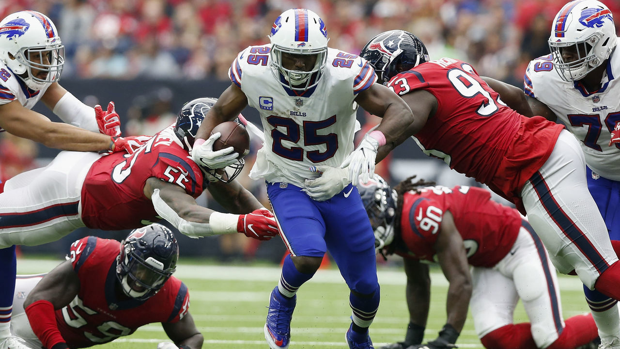 HOUSTON, TX - OCTOBER 14: LeSean McCoy #25 of the Buffalo Bills rus the ball defended by Benardrick McKinney #55 of the Houston Texans and Joel Heath #93 in the second half at NRG Stadium on October 14, 2018 in Houston, Texas.
