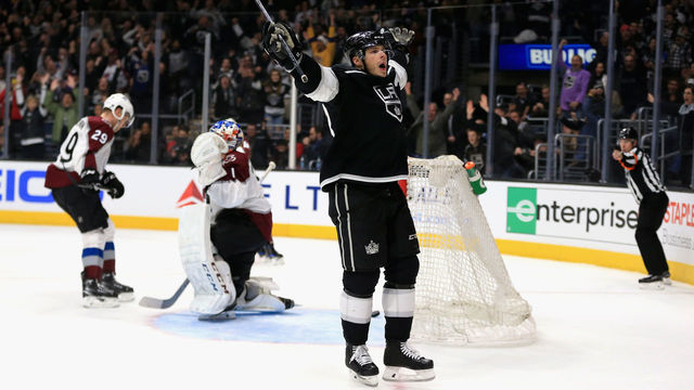 LOS ANGELES, CA - DECEMBER 21: Semyon Varlamov #1 and Nathan MacKinnon #29 of the Colorado Avalanche look on after Dustin Brown #23 of the Los Angeles Kings scores the winning goal in overtime during a game at Staples Center on December 21, 2017 in Los Angeles, California. Brown was playing in his one thousandth NHL game.