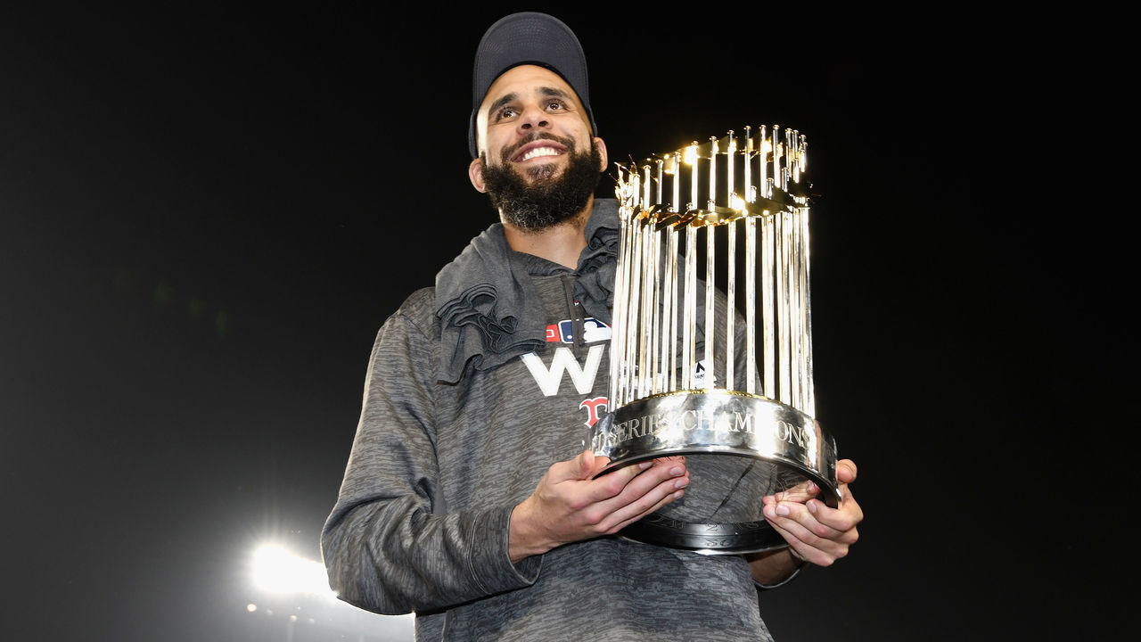 LOS ANGELES, CA - OCTOBER 28: David Price #24 of the Boston Red Sox celebrates with the World Series trophy after his team's 5-1 win over the Los Angeles Dodgers in Game Five to win the 2018 World Series at Dodger Stadium on October 28, 2018 in Los Angeles, California.