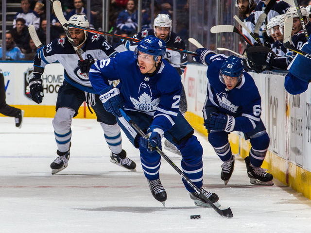 TORONTO, ON - OCTOBER 27: Par Lindholm #26 of the Toronto Maple Leafs skates with the puck against the Winnipeg Jets during the second period at the Scotiabank Arena on October 27, 2018 in Toronto, Ontario, Canada.