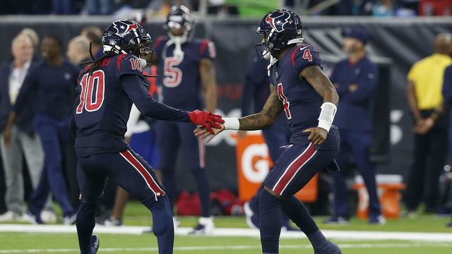 HOUSTON, TX - OCTOBER 25: DeAndre Hopkins #10 of the Houston Texans congratulates Deshaun Watson #4 after a touchdown pass in the third quarter at NRG Stadium on October 25, 2018 in Houston, Texas.