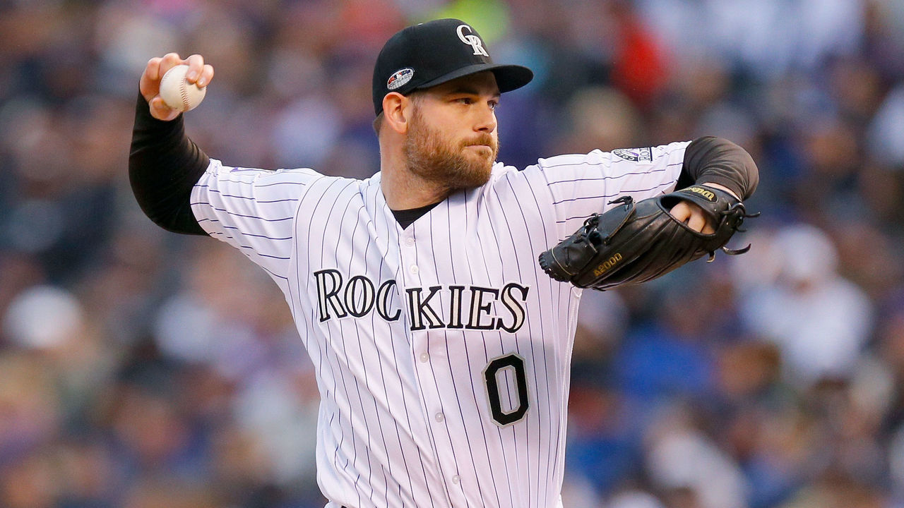 DENVER, CO - OCTOBER 07: Adam Ottavino #0 of the Colorado Rockies pitches in the seventh inning of Game Three of the National League Division Series against the Milwaukee Brewers at Coors Field on October 7, 2018 in Denver, Colorado.