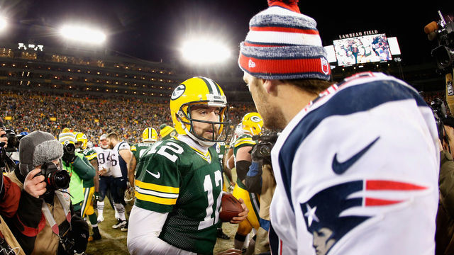 GREEN BAY, WI - NOVEMBER 30: Quarterbacks Aaron Rodgers #12 of the Green Bay Packers and Tom Brady #12 of the New England Patriots shake hands following the NFL game at Lambeau Field on November 30, 2014 in Green Bay, Wisconsin. The Packers defeated the Patriots 26-21.