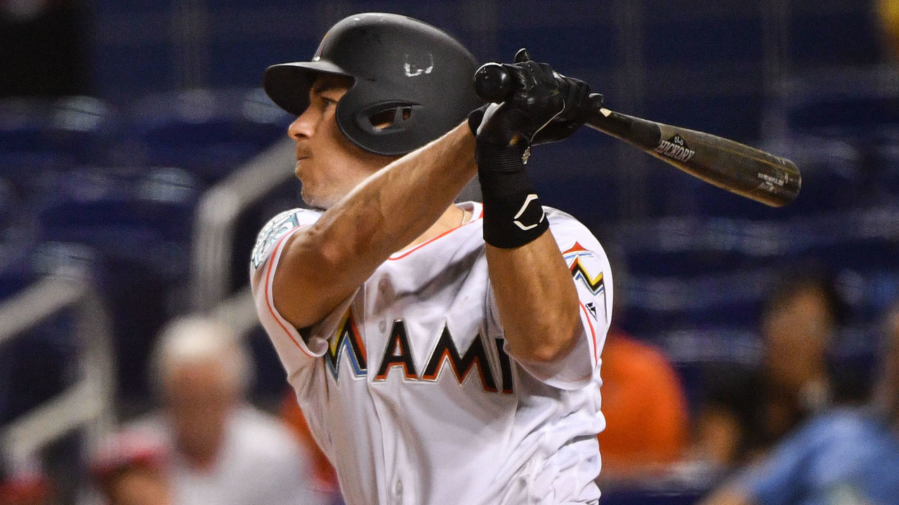 MIAMI, FL - JULY 26: J.T. Realmuto #11 of the Miami Marlins singles in the eighth inning against the Washington Nationals at Marlins Park on July 26, 2018 in Miami, Florida.