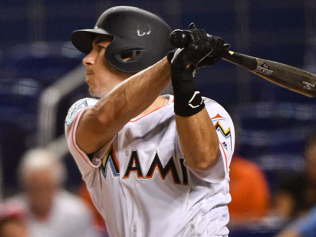 MIAMI, FL - JULY 26: J.T. Realmuto #11 of the Miami Marlins singles in the eighth inning against the Washington Nationals at Marlins Park on July 26, 2018 in Miami, Florida.