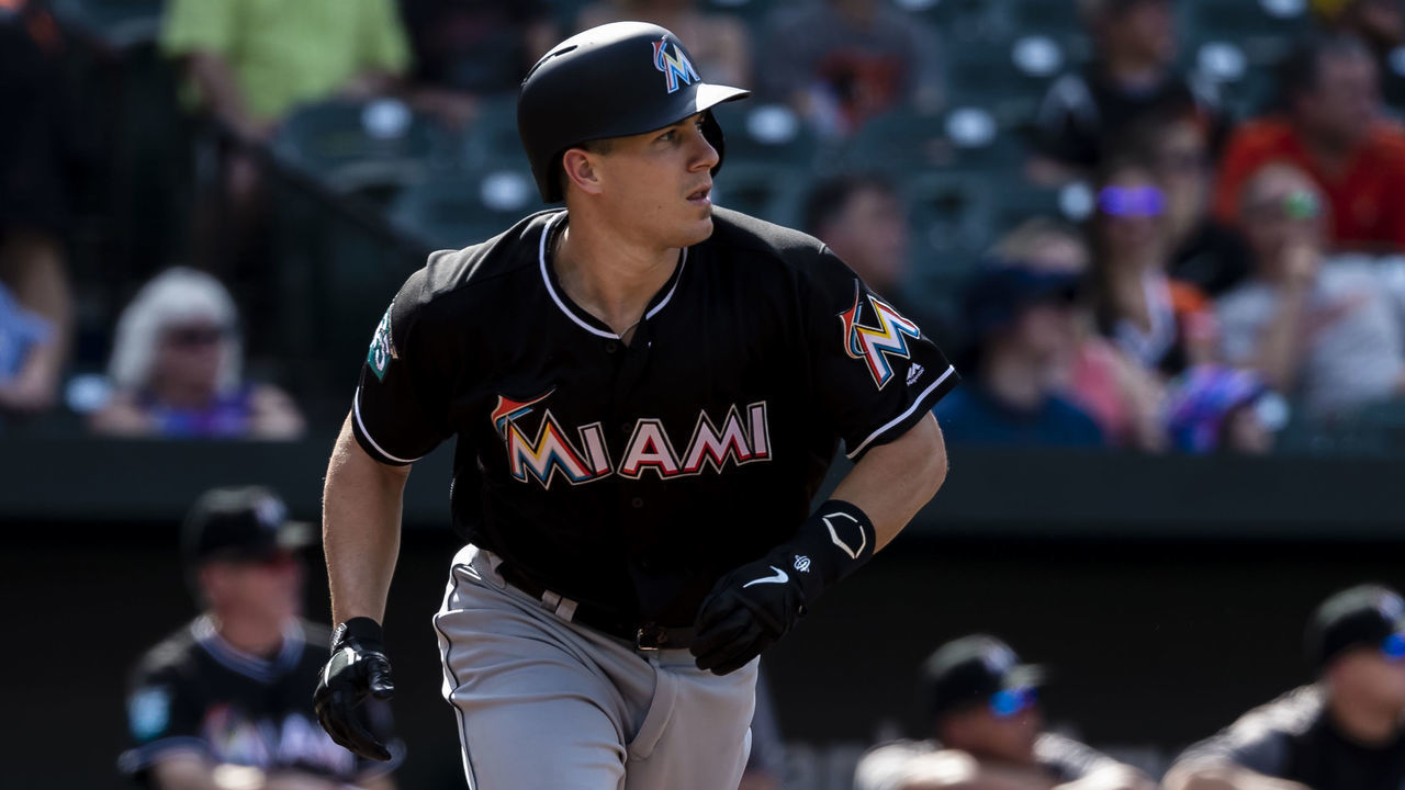 BALTIMORE, MD - JUNE 16: J.T. Realmuto #11 of the Miami Marlins hits a two-run homerun during the third inning against the Baltimore Orioles at Oriole Park at Camden Yards on June 16, 2018 in Baltimore, Maryland.