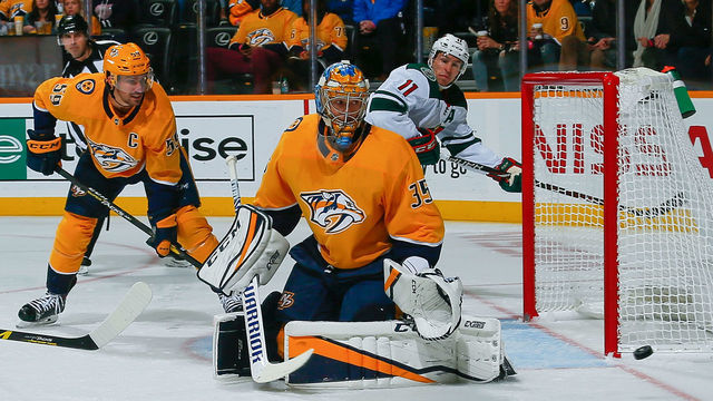 NASHVILLE, TN - OCTOBER 15: Roman Josi #59 and Pekka Rinne #35 of the Nashville Predators and Zach Parise #11 of the Minnesota Wild watch a puck go wide of the net during the second period at at Bridgestone Arena on October 15, 2018 in Nashville, Tennessee.