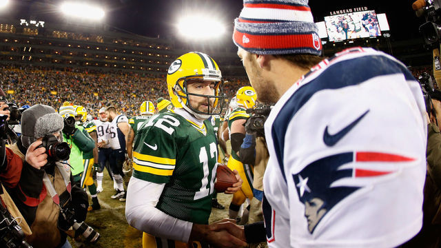 GREEN BAY, WI - NOVEMBER 30: Quarterbacks Aaron Rodgers #12 of the Green Bay Packers and Tom Brady #12 of the New England Patriots shake hands following the NFL game at Lambeau Field on November 30, 2014 in Green Bay, Wisconsin. The Packers defeated the Patriots 26-21.