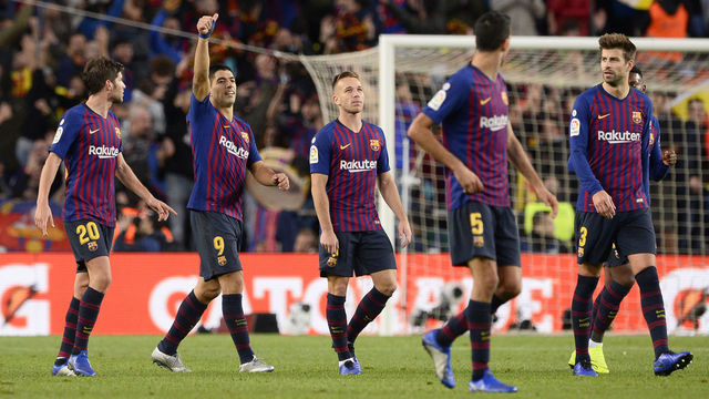 Barcelona's Uruguayan forward Luis Suarez (2L) celebrates his third goal with teammates during the Spanish league football match between FC Barcelona and Real Madrid CF at the Camp Nou stadium in Barcelona on October 28, 2018.