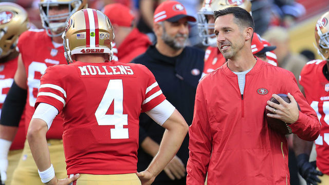 SANTA CLARA, CA - NOVEMBER 01: Head coach Kyle Shanahan speaks with Nick Mullens #4 of the San Francisco 49ers prior to their game against the Oakland Raiders at Levi's Stadium on November 1, 2018 in Santa Clara, California.