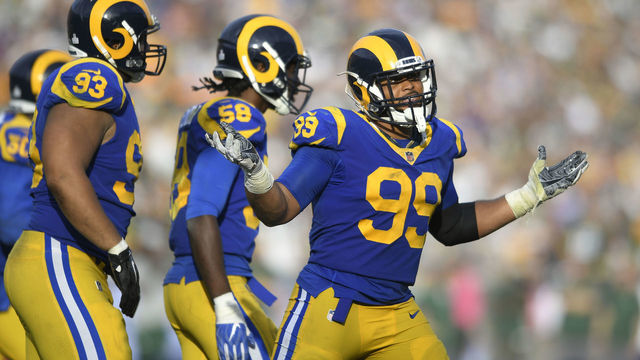 LOS ANGELES, CA - OCTOBER 28: Aaron Donald #99 of the Los Angeles Rams celebrates after he sacked Aaron Rodgers #12 of the Green Bay Packers at Los Angeles Memorial Coliseum on October 28, 2018 in Los Angeles, California.