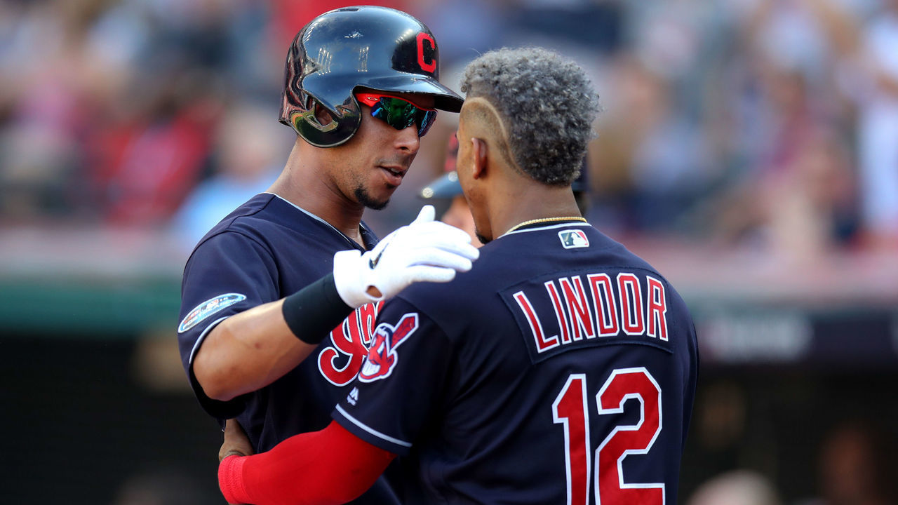CLEVELAND, OH - OCTOBER 08: Cleveland Indians left fielder Michael Brantley (23) is congratulated by Cleveland Indians shortstop Francisco Lindor (12) after hitting a sacrifice fly during the third inning of the American League Divisional Series Game 3 between the Houston Astros and Cleveland Indians on October 8, 2018, at Progressive Field in Cleveland, OH. Houston defeated Cleveland 11-3 to win the series 3 games to none.