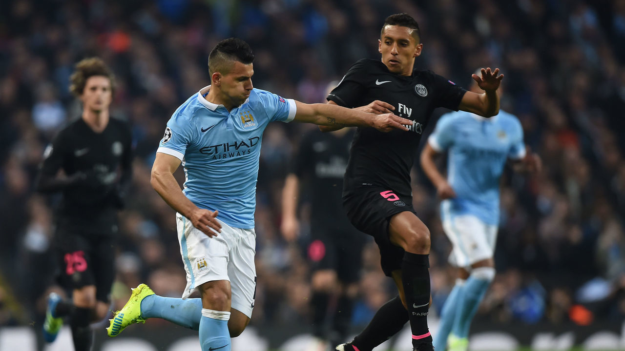 MANCHESTER, ENGLAND - APRIL 12: Sergio Aguero of Manchester City and Marquinhos of Paris Saint-Germain in action during the UEFA Champions League Quarter Final Second Leg match between Manchester City FC and Paris Saint-Germain at the Etihad Stadium on April 12, 2016 in Manchester, United Kingdom.