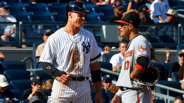 NEW YORK, NY - SEPTEMBER 17: Aaron Judge #99 of the New York Yankees and Manny Machado #13 of the Baltimore Orioles talk at third base during a game at Yankee Stadium on September 17, 2017 in the Bronx borough of New York City. The Orioles defeated the Yankees 6-4.