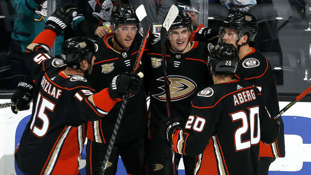 ANAHEIM, CA - OCTOBER 30: Cam Fowler #4, Jakob Silfverberg #33, Rickard Rakell #67, Ryan Getzlaf #15, and Pontus Aberg #20 of the Anaheim Ducks celebrate Aberg's third period goal during the game against the Philadelphia Flyers on October 30, 2018 at Honda Center in Anaheim, California.