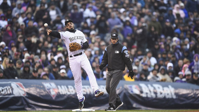DENVER, CO - OCTOBER 7: Nolan Arenado #28 of the Colorado Rockies turns a double play to end the seventh inning during Game 3 of the NLDS against the Milwaukee Brewers at Coors Field on Sunday, October 7, 2018 in Denver, Colorado.
