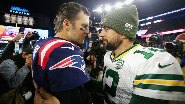 FOXBOROUGH, MA - NOVEMBER 04: Tom Brady #12 of the New England Patriots talks with Aaron Rodgers #12 of the Green Bay Packers after the Patriots defeated the Packers 31-17 at Gillette Stadium on November 4, 2018 in Foxborough, Massachusetts.