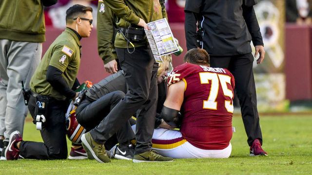 LANDOVER, MD - NOVEMBER 4: Washington Redskins head coach Jay Gruden comes onto the field to check on his offensive guard Brandon Scherff (75) during third quarter action against the Atlanta Falcons at FedEx Field.