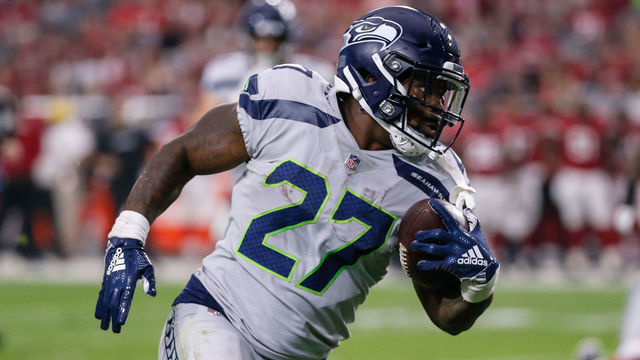 GLENDALE, AZ - SEPTEMBER 30: Seattle Seahawks running back Mike Davis (27) runs the ball on his way to a touchdown during the NFL football game between the Seattle Seahawks and the Arizona Cardinals on September 30, 2018 at State Farm Stadium in Glendale, Arizona.